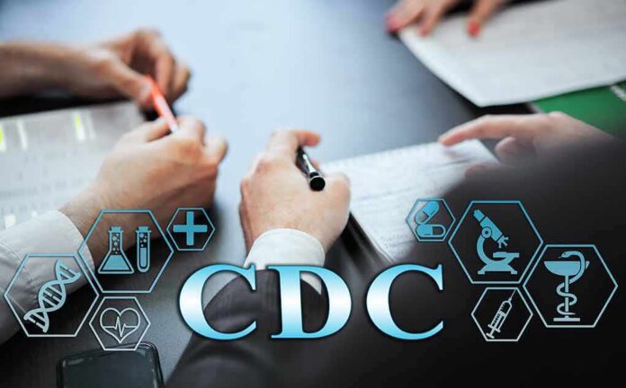 Hands writing notes at a meeting table with medical icons overlay
