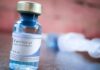 New Super-Drug Stronger Than Fentanyl Spreading Across U.S. Fentanyl vial on a table with blurred syringe in background