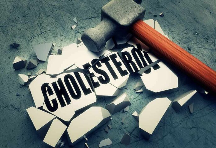 Sledgehammer smashing a tile labeled cholesterol