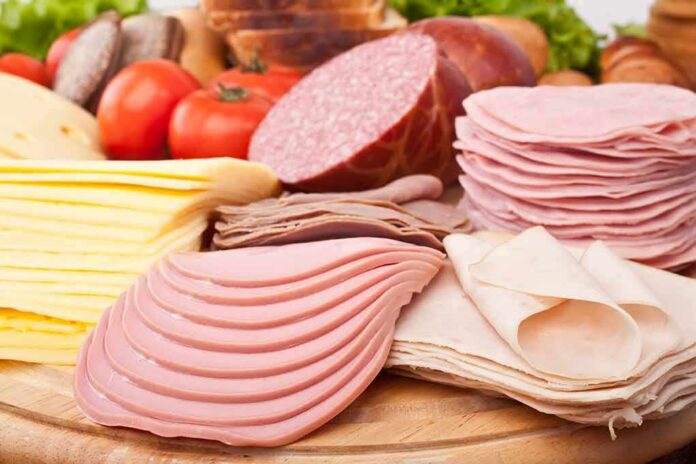 shutterstock_50635486 Assorted deli meats and sliced cheese on a wooden board