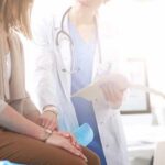Doctor consulting with patient in clinic